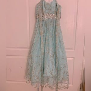 Size 12 formal teal blue, with gold and silver accent gown